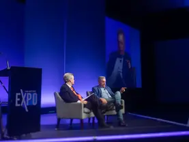 Steve Eisman (right) talks with Eric O'Keefe at the 2025 Land Investment Expo in Des Moines Iowa on January 14, 2025. 