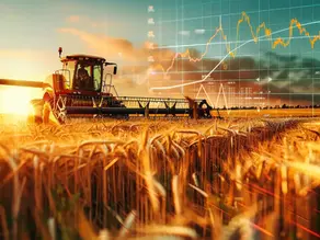 Graphic overlay of tractor in a wheat field at harvest with economic graph
