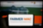 Phone and computer screen showing farmer macs website
