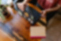 Dorothy opening her laptop at a cafe table | Dorothy Fee | freelance copywriter | copywriting portfolio