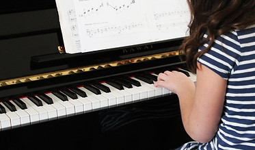 Girl Playing Beginner Piano