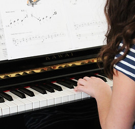 Girl Playing Beginner Piano