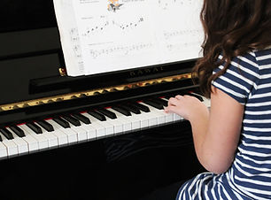 Girl Playing Beginner Piano