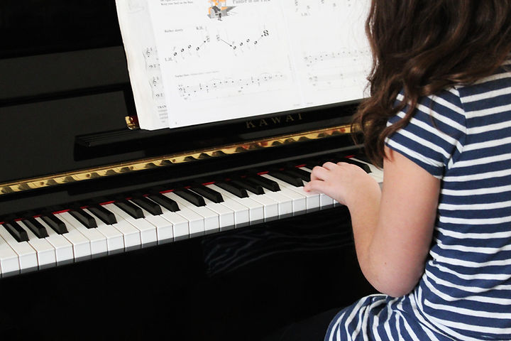 Girl Playing Beginner Piano