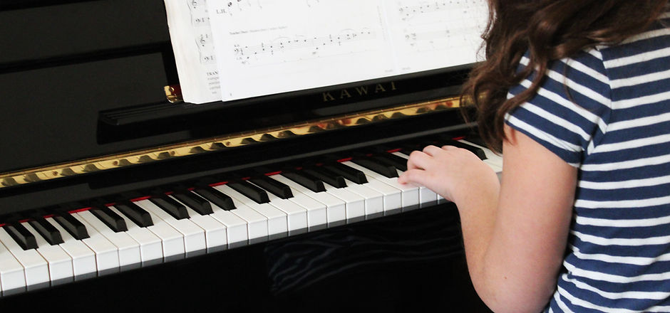 Girl Playing Beginner Piano