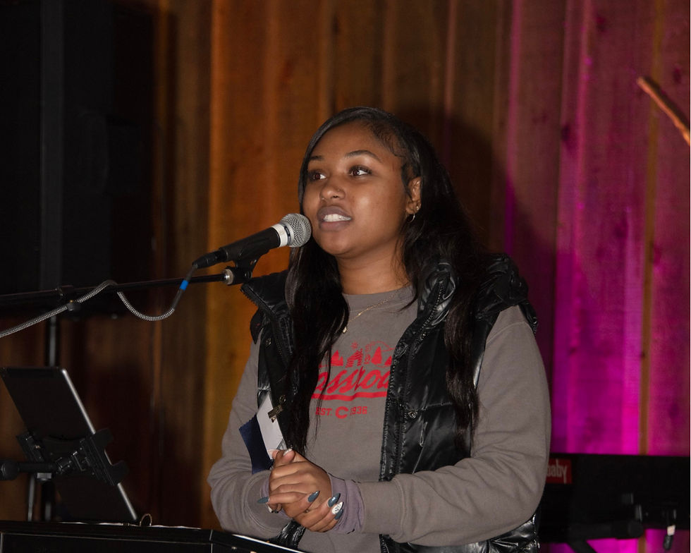 Young woman speaking at podium