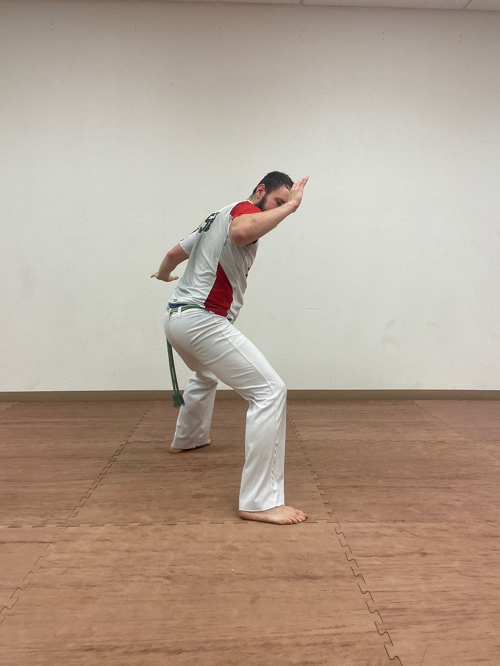 Capoeira student starting Queixada