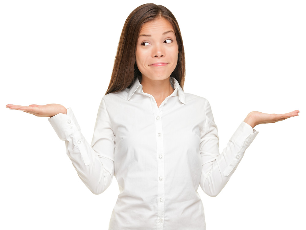 Woman holding both palms up, like a weight scale.