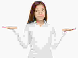 Woman holding both palms up, like a weight scale.