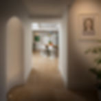 view through into modern kitchen with white walls and stone floor