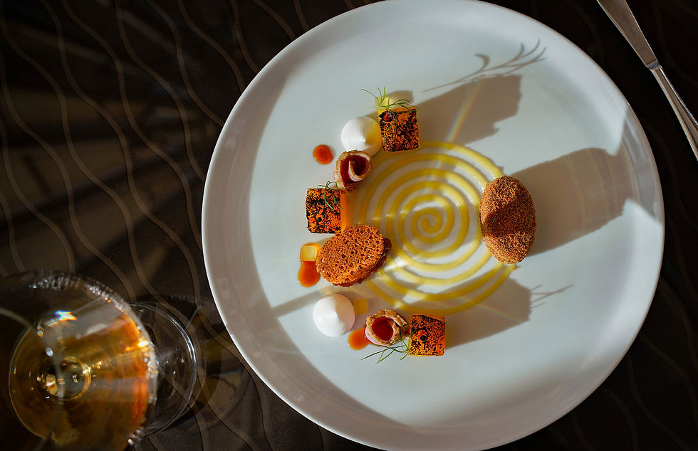 Plate of beautifully arranged Michelin star food from L'ortolan and Chef Tom Clarke