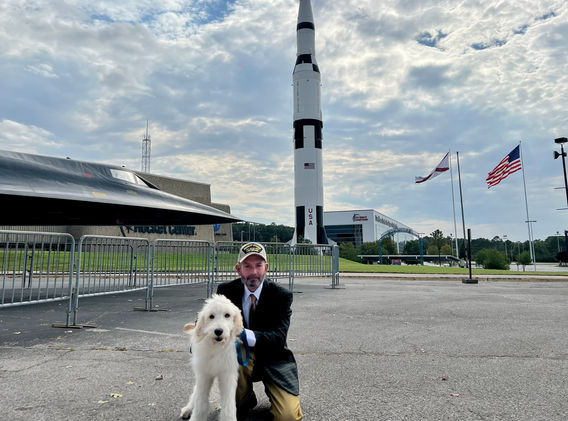 Willis Arnold, posing with his dog, Archie.