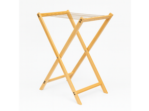 Foldable wooden hotel laundry rack made of solid beech wood, walnut finish, heavy-duty drying stand for luxury guest rooms and balconies.