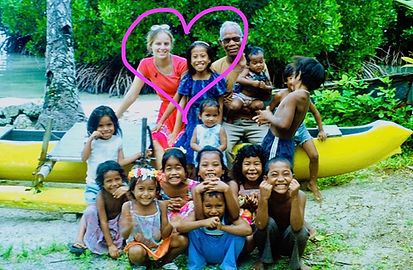 ainar and children on canoe.jpeg
