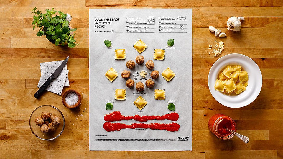 A piece of parchment paper with a recipe on it sit on a counter with pasta ingredients on top of it. it reads, cook this page: parchment recipe.