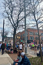 Crowd celebrating on Liberty St., vibrant colors and lots of people