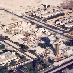 Aerial photo of Al Khazzan water tower and park under construction in 1983