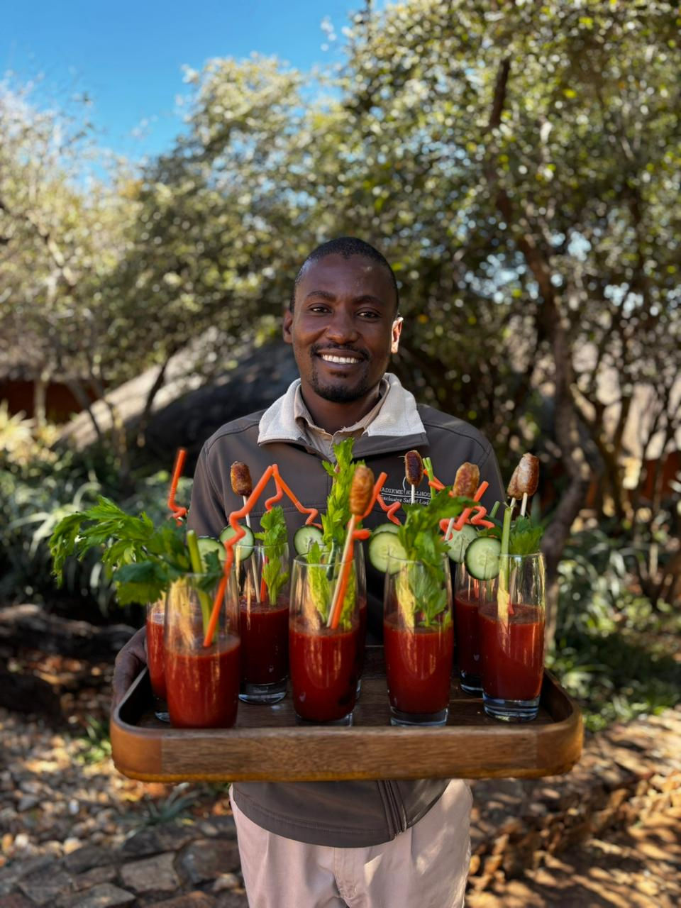 Lodge Staff Welcoming Guests with Welcome Drinks.jpg