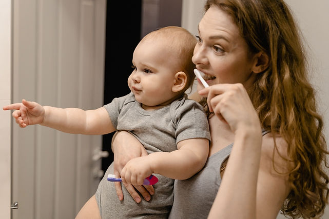 Mom and Baby brudhing their teeth together.jpg