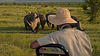 Rhino on Safari with Safari Guide in the foreground.jpg