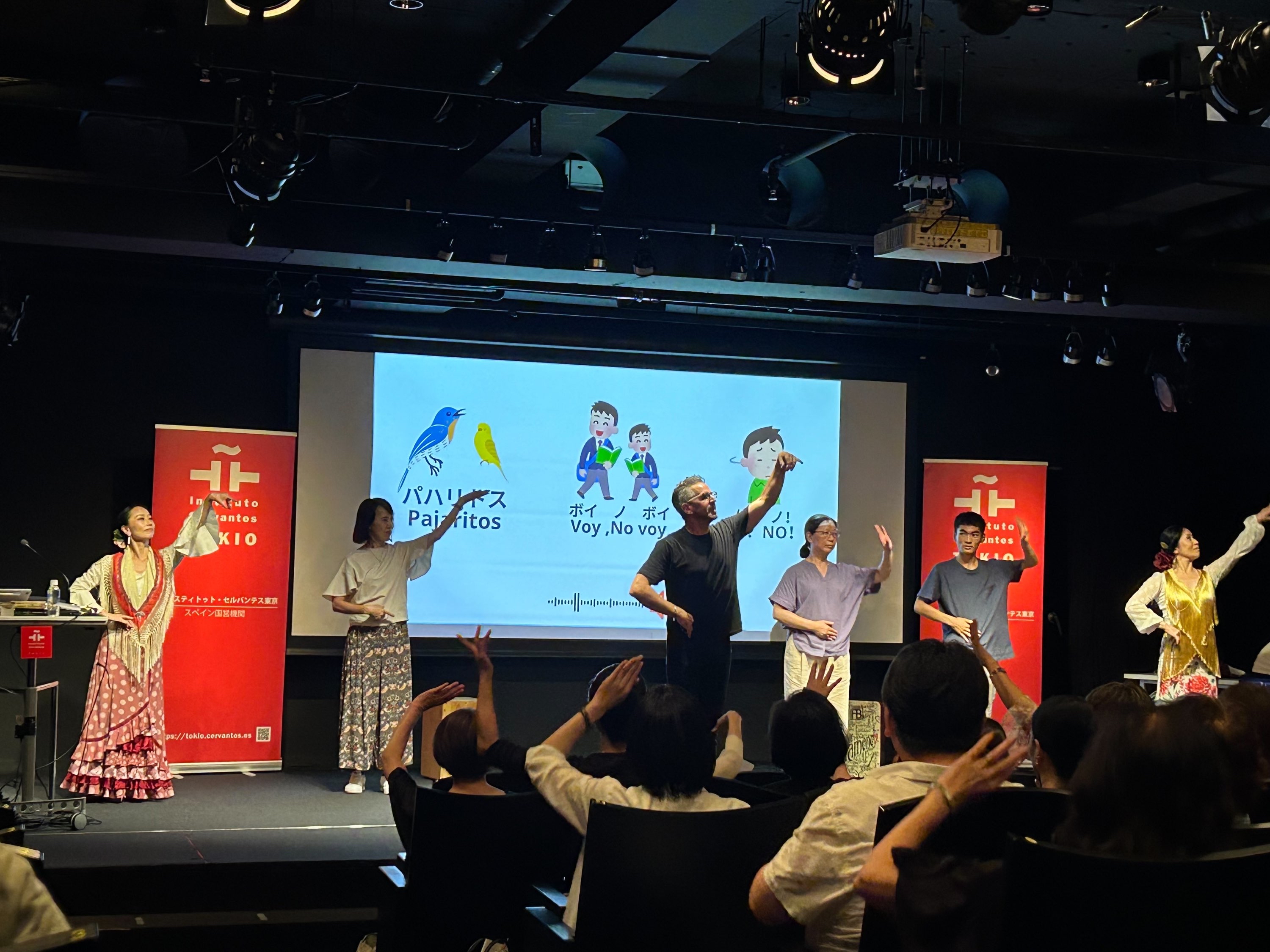Beni, fellow performers and the audience join in a simple choreography during the lecture