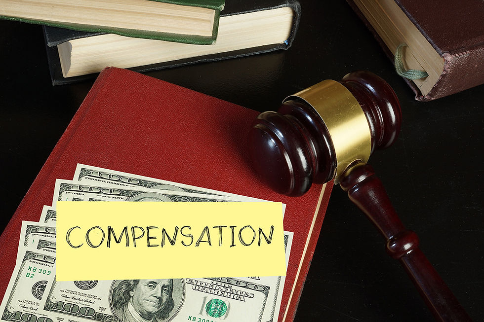 Gavel, Money, Compensation on a desk Image - No Workers’ Comp? Can I Still Sue My Employer? Harris County, TX Guide