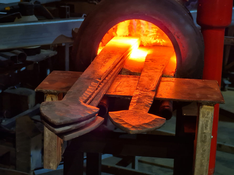 Heated iron bars glowing in a forge during traditional blacksmithing work