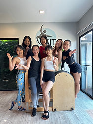 Group of people participating in a Pilates class at Sita Pilates Thailand