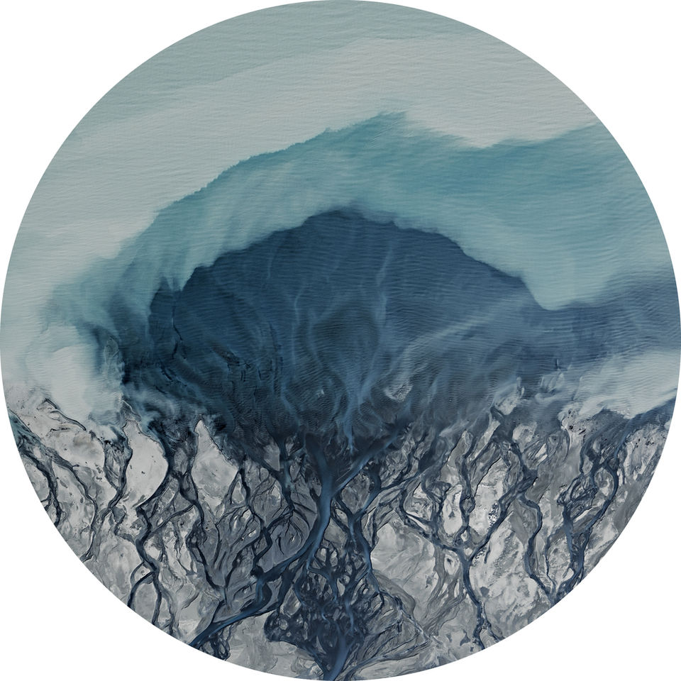 fine art aerial photo of land and water formations in turquoise, blue and green.