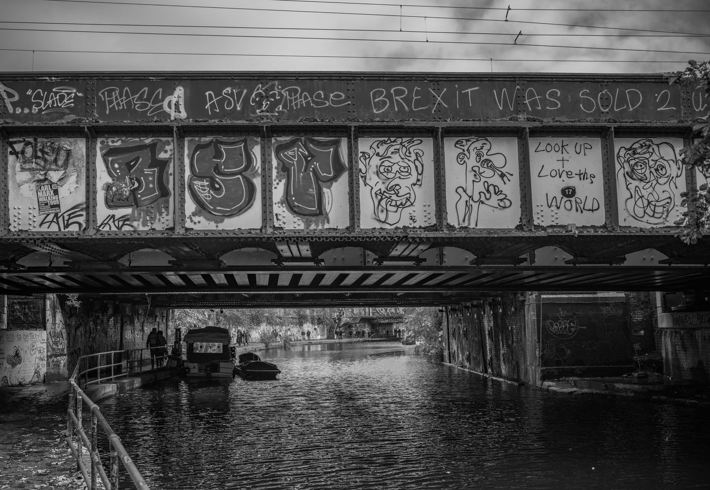 Black and white landscape, fine art photograph of a graffiti bridge.