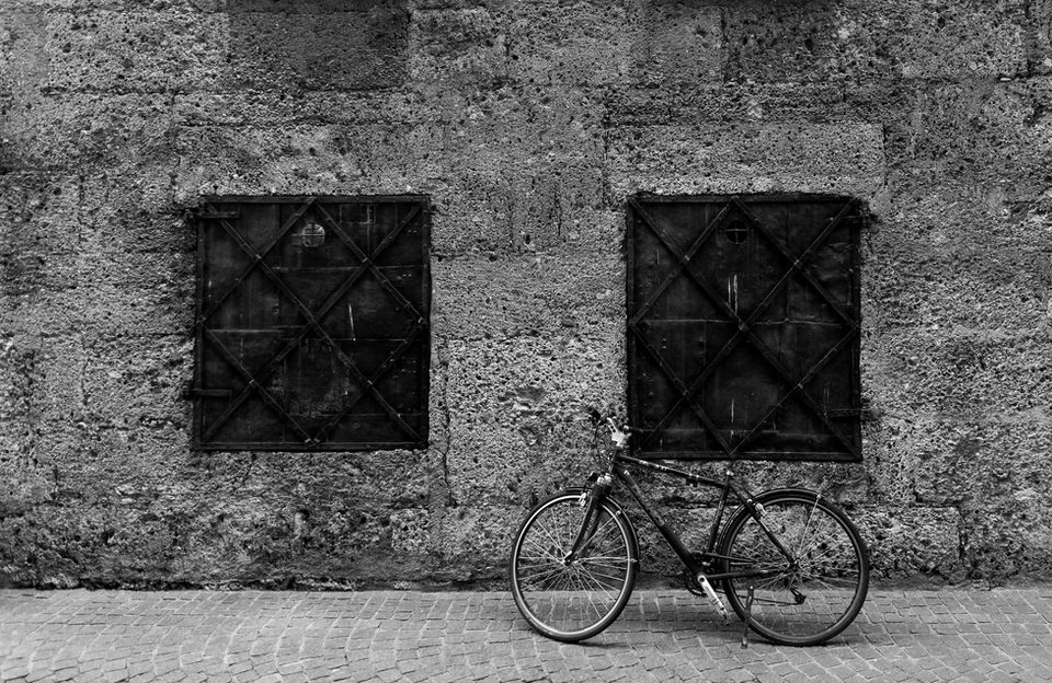 fine art street photography of bicycle against a wall. For sale in Auckland gallery