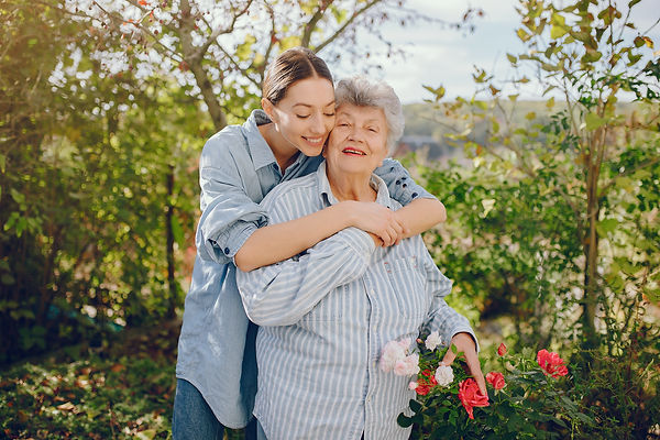 old-woman-in-a-garden-with-young-granddaughter-2021-08-27-16-34-47-utc.jpg
