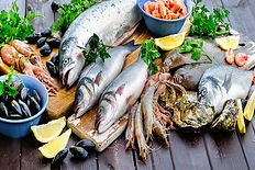 Raw seafood on wooden table