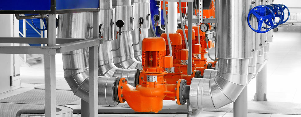 Modern industrial boiler room with pumps and pipe lines supplying steam with pressure gauges installed in