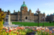 Historic British Columbia provincial parliament building with spring tulips, Victoria, BC, Canada