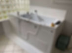 Bathtub shell inside a bathroom with big glass windows