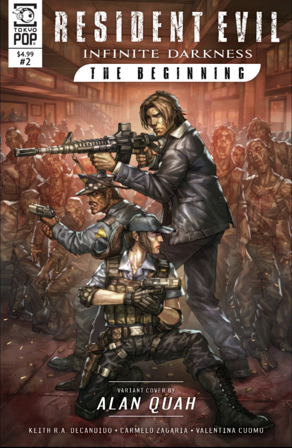 This striking variant cover for Tokyopop’s Resident Evil: Infinite Darkness - The Beginning Issue #2 features intense artwork by Alan Quah. Set inside a dimly lit, warm-toned corridor, the piece showcases a desperate defensive stand as a massive, bloody horde of zombies encroaches from all sides. Leon S. Kennedy stands tall at the center, aiming an assault rifle, while a male police officer and a kneeling female tactical officer cover the flanks with handguns amidst scattered bullet casings on the floor. The top of the cover proudly displays the distressed Resident Evil title logo, while the bottom credits artist Alan Quah alongside series creators Keith R.A. DeCandido, Carmelo Zagaria, and Valentina Cuomo.