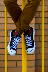 Person Sitting on Gate