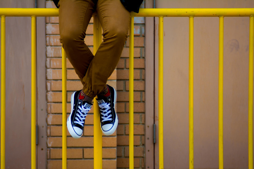 Man sitting on Fence