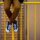 Person Sitting on Gate