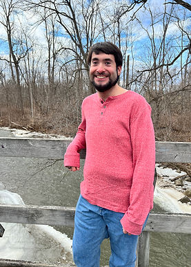 Michael next to a stream