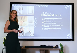 Gabriela Zubair delivering a workplace wellbeing workshop on psychological safety, resilience and trauma-informed leadership.