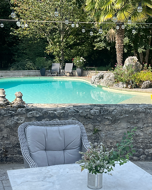 Swimming pool with outdoor seating and garden