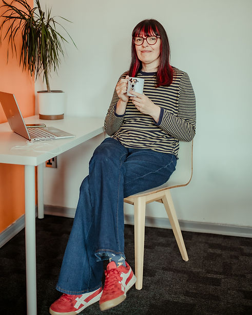 Me at laptop full body with a cup of tea_edited.jpg