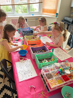 Children enjoy arts and crafts at a themed birthday party