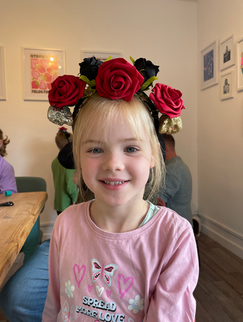Young girl wearing a floral headband at a party