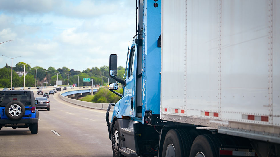A blue Sagepoint Logsitics CNG truck driving down the interstate. 