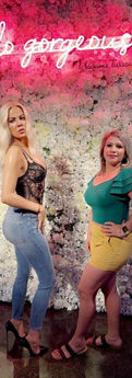 Woman posing with Khloe Kardashian wax figure at Madame Tussauds museum in Las Vegas