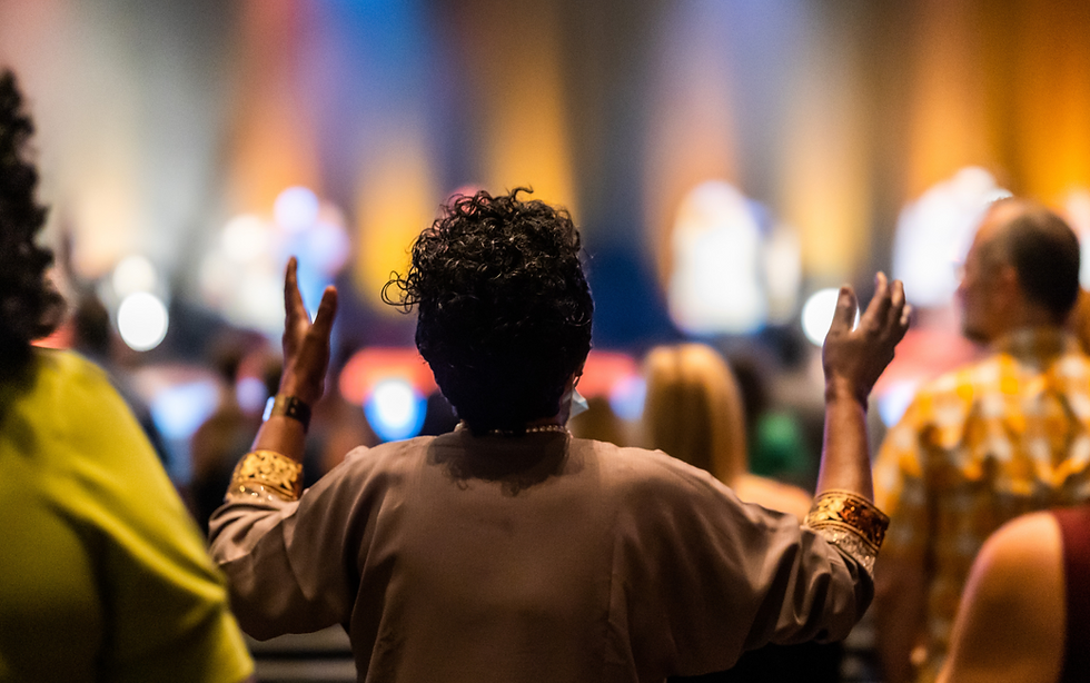 Congregation worshiping with raised hands, Christian worship and outreach