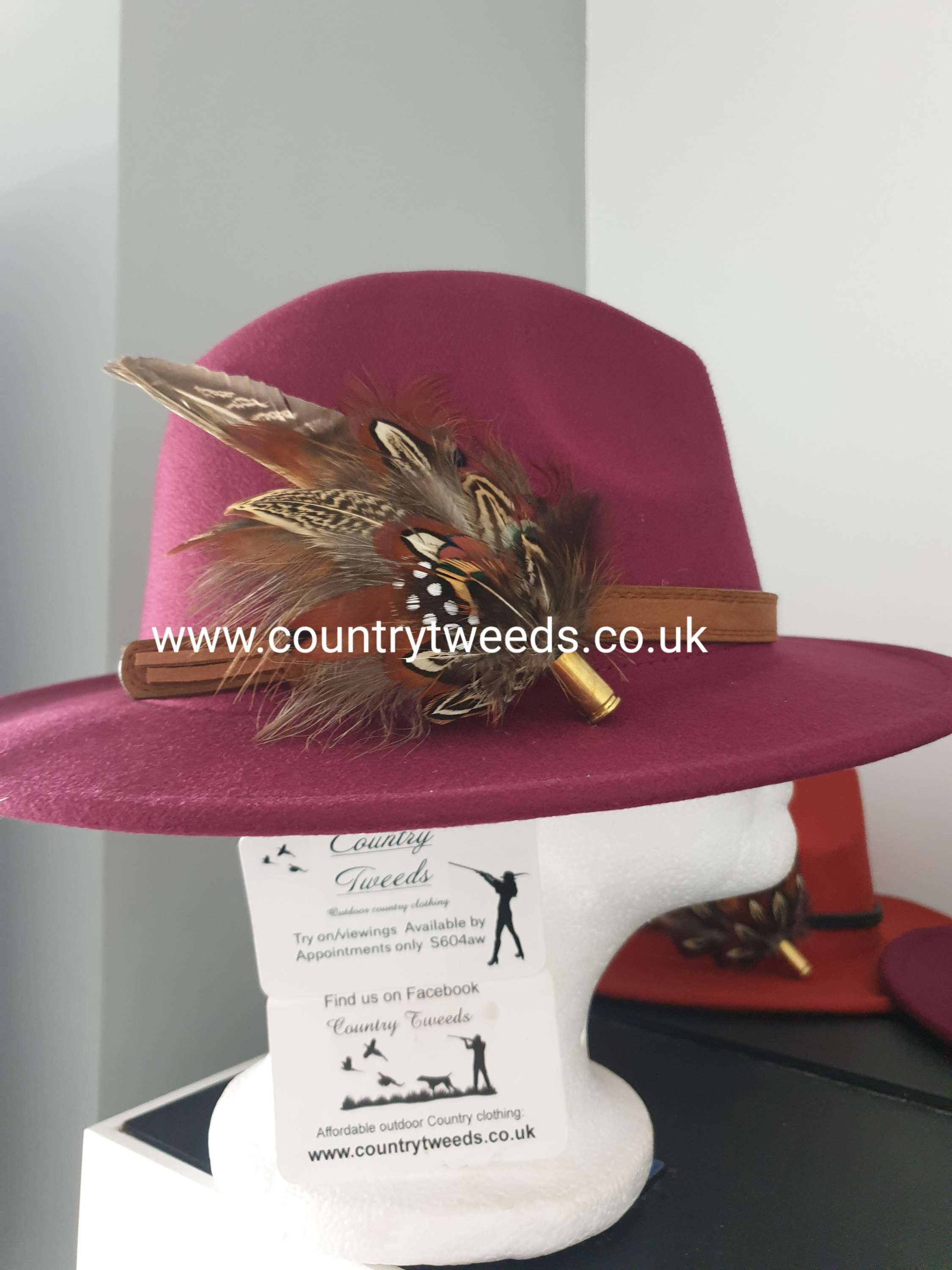 Burgundy fedora hat comes with this beautiful detachable feather brooch